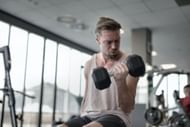 Concentration curls. (Image via Pexels/ Andrea Piacquadio)